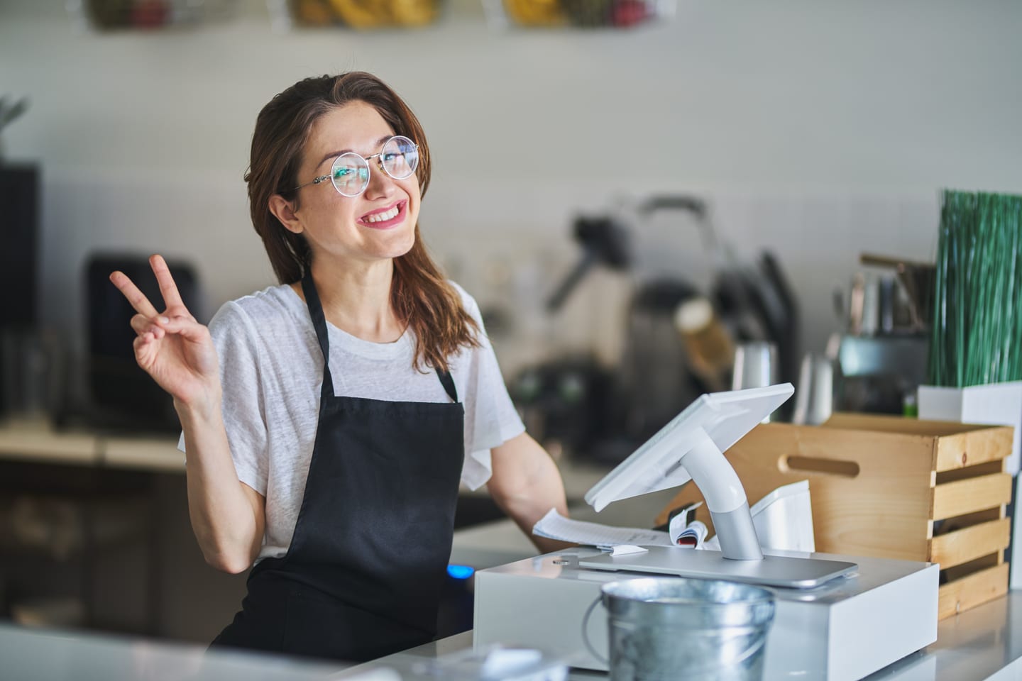Friendly shop assistant smiling at a customer in a Northeast Ohio retail store — great service experiences are the foundation of strong Google reviews