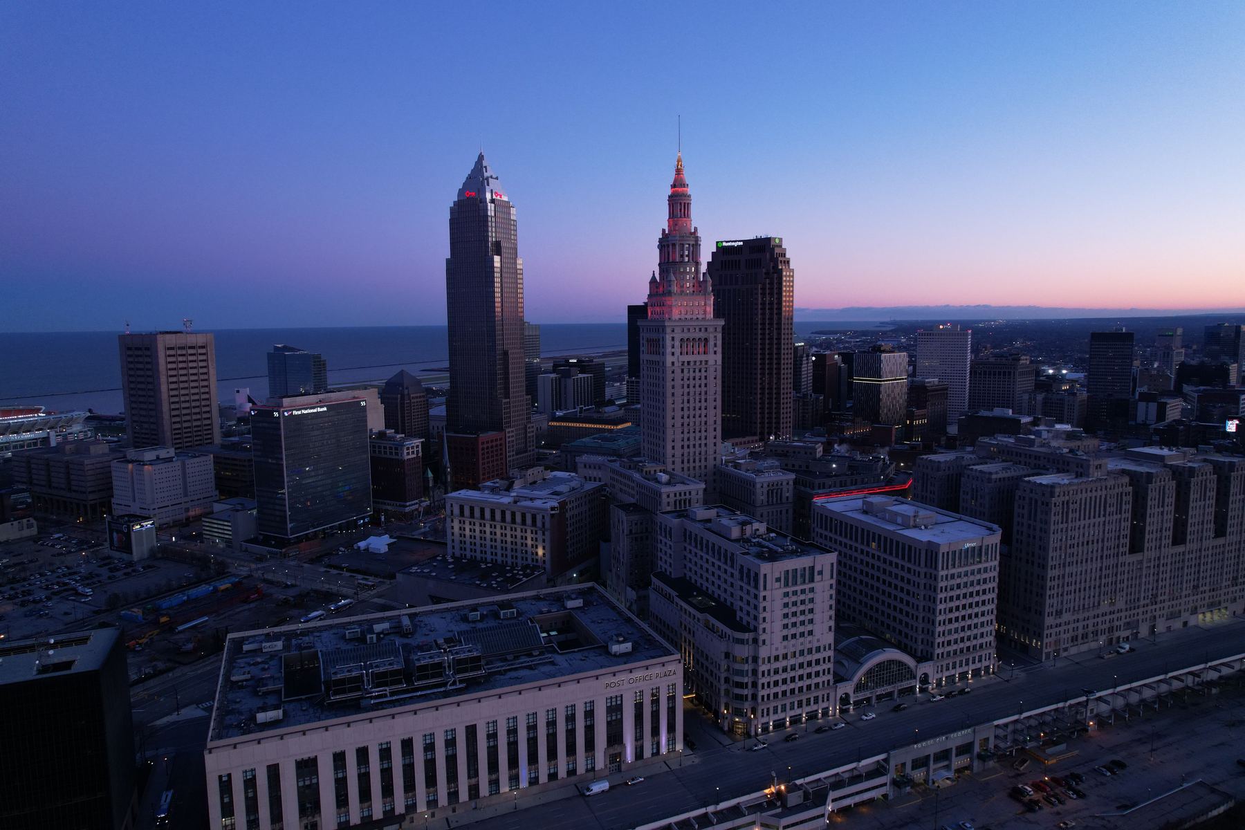 Cleveland skyline and downtown buildings near the lake at dusk, representing the local businesses competing for search visibility